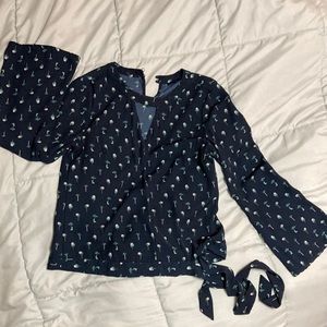 Ava med navy floral long sleeve blouse. Slight bell sleeve. Fits like a small.